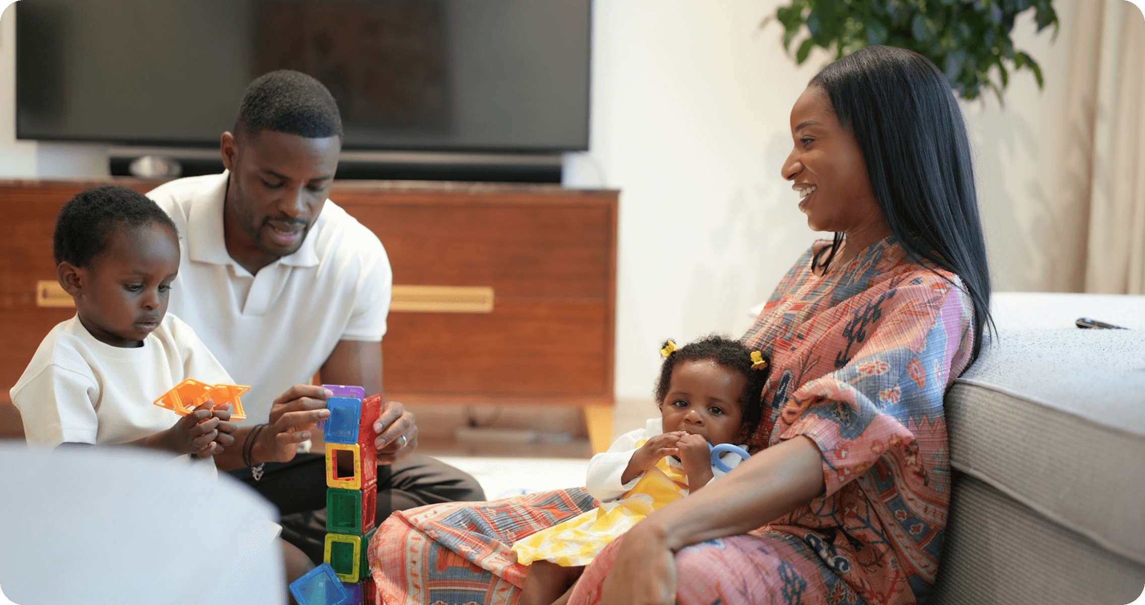 Happy family smiling on a couch